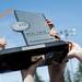 The Michigan softball team celebrates with the Big Ten trophy after the game against Northwestern on Sunday, May 5. Daniel Brenner I AnnArbor.com